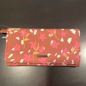 Floral wallet. Brand Roxy. New with tags. Never been used.